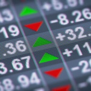 A close up of the numbers on a stock market board.